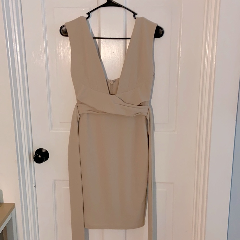 Lulu’s dress tight fit deep neckline. Tan